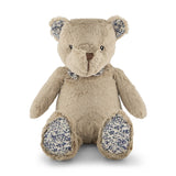 Plush teddy bear with floral patterns on a white background