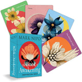 Card deck with floral designs and 'The Book of Awakening' by Mark Nepo on a white background