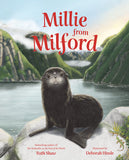 Book cover of 'Millie from Milford' with a seal on rocks by a lake and mountains.